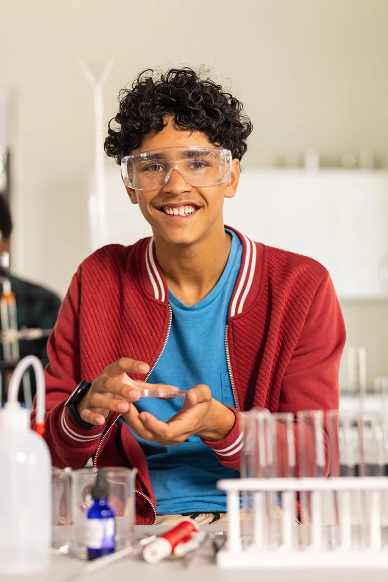 Young student in high school chemistry class
